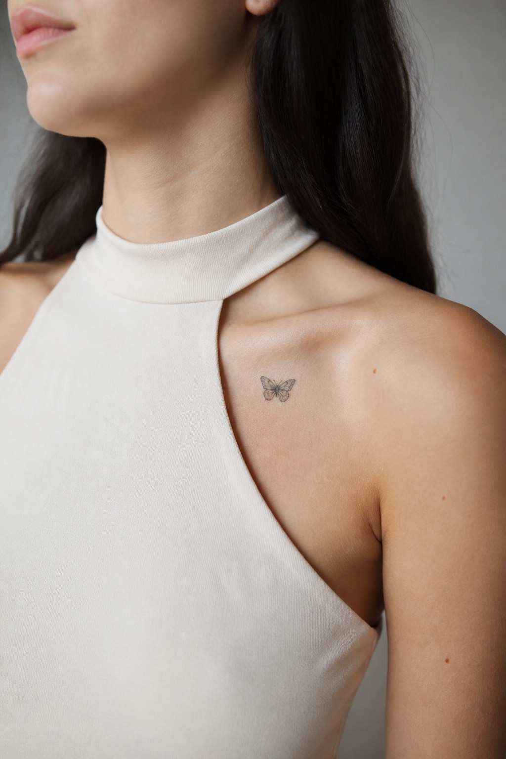 Micro realism butterfly collarbone tattoo for women