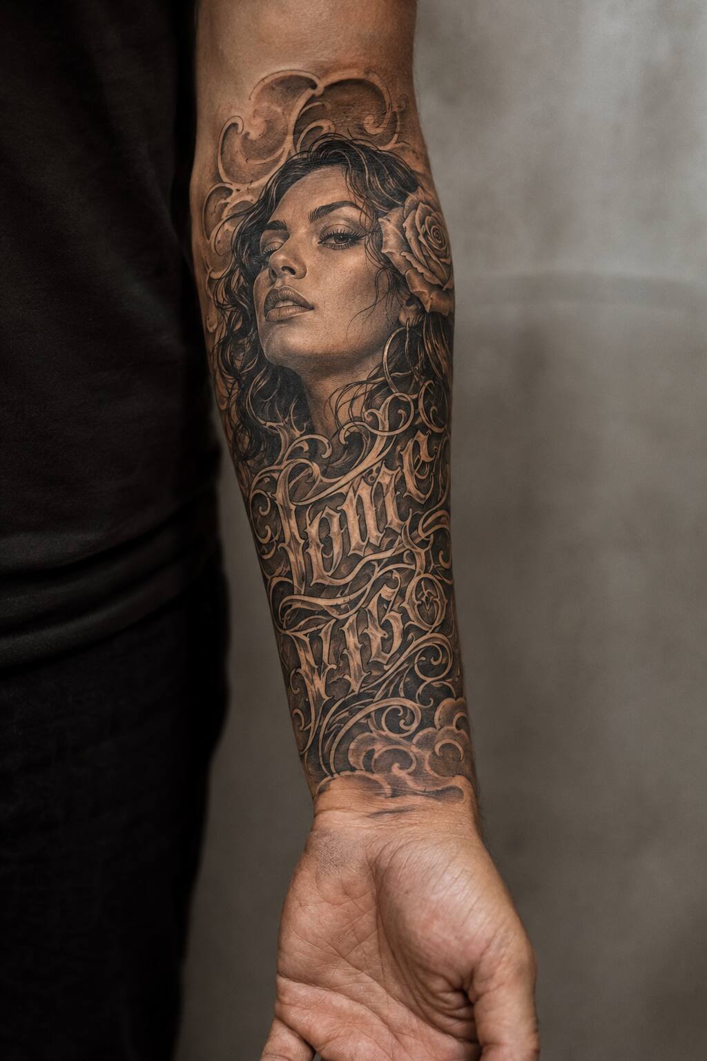 Chicano style lettering and portrait forearm sleeve tattoo for men