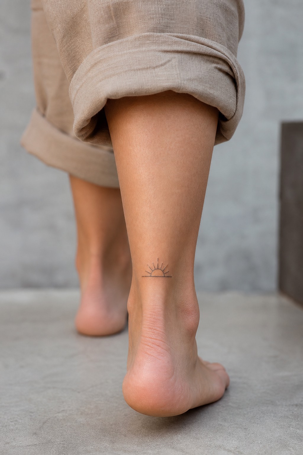 Minimalist ankle sun silhouette tattoo for women