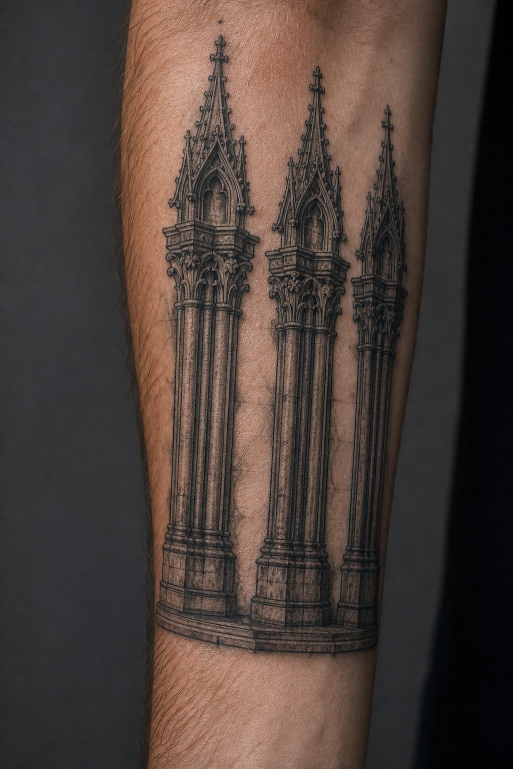 Gothic pillar and column sequence forearm tattoo