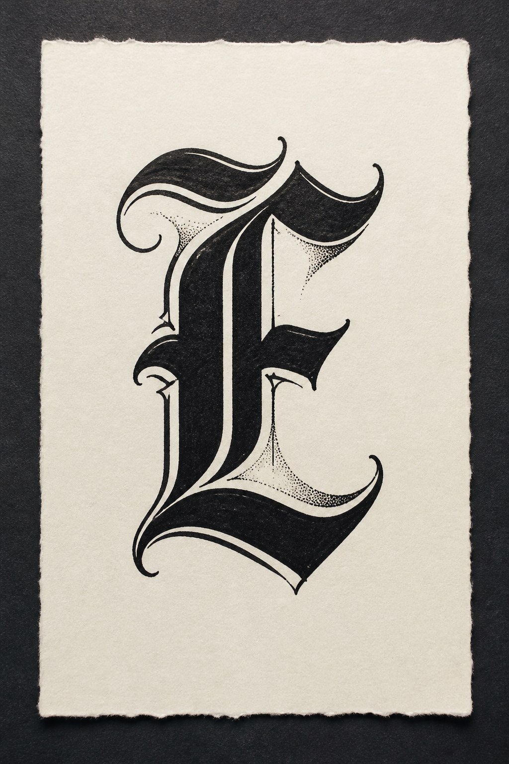 Gothic blackletter initial flash tattoo