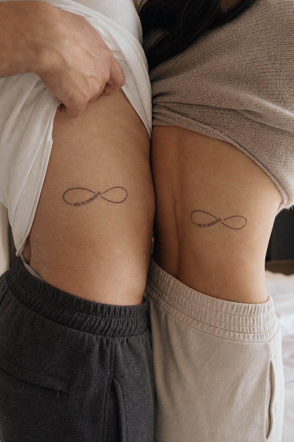 Ribcage infinity line work hidden couple tattoos