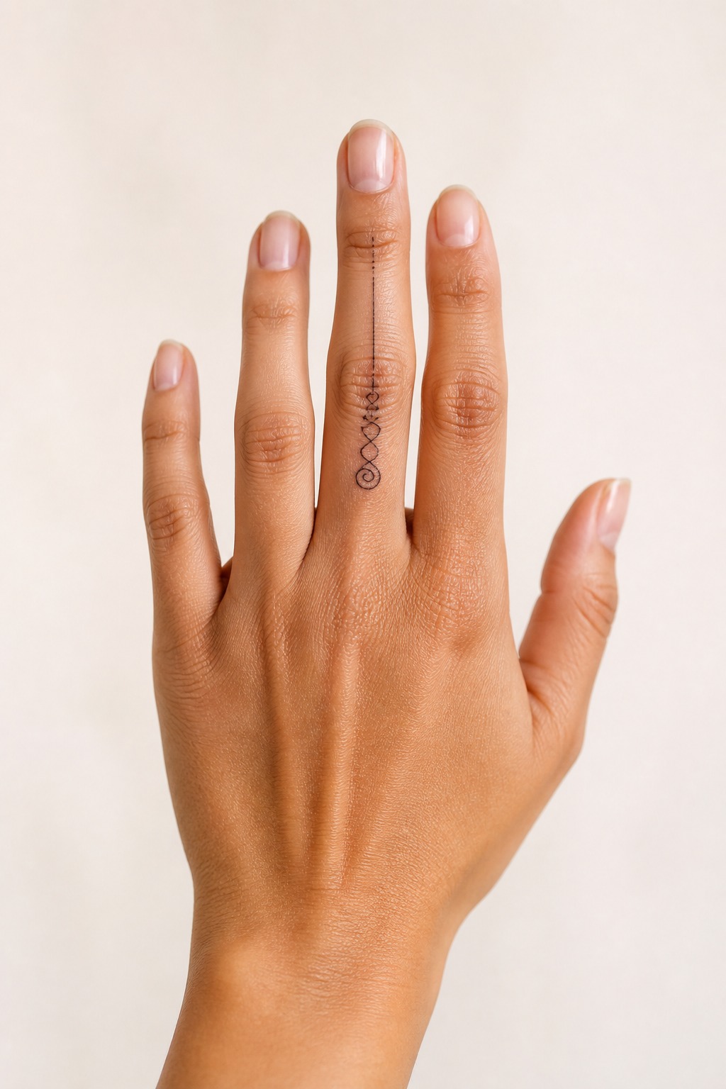 Fine line unalome middle finger accent tattoo for women