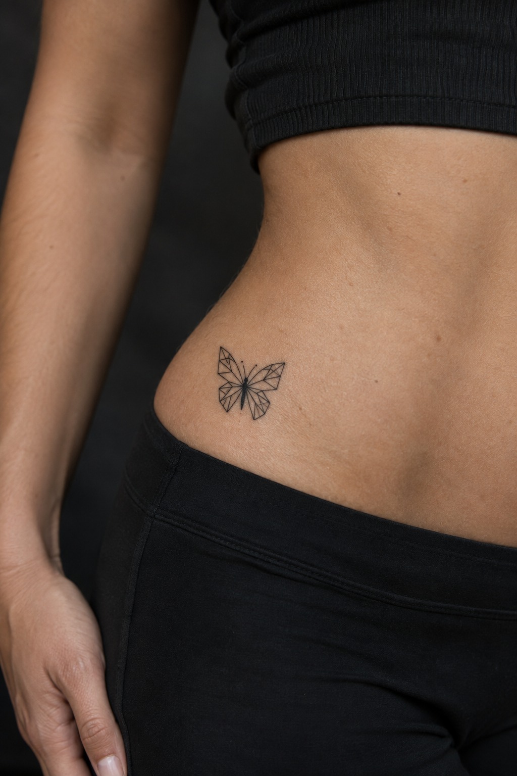 Minimalist geometry butterfly hip tattoo